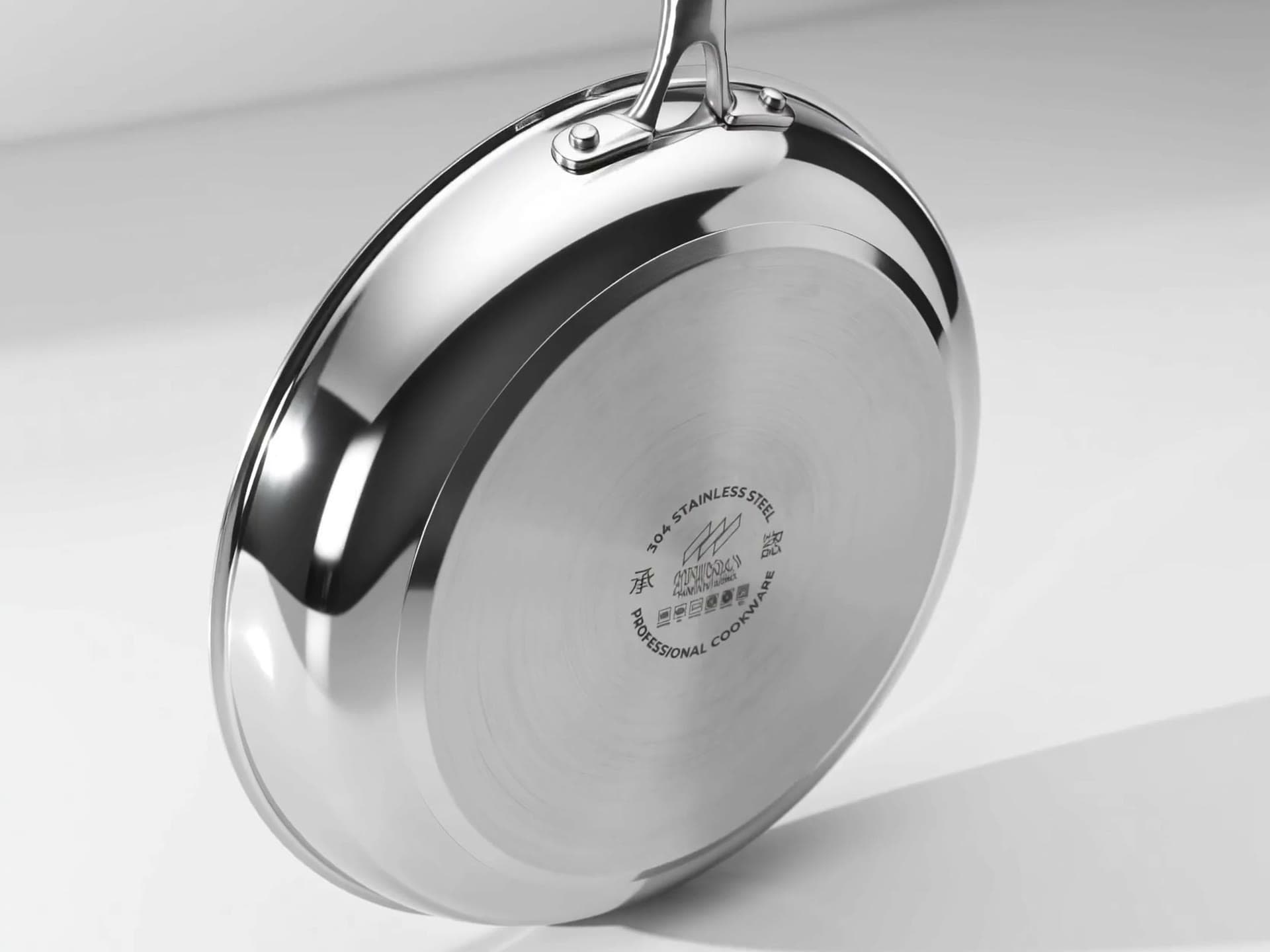 Machined base of a SEIDO stainless steel frying pan with the engraved seal